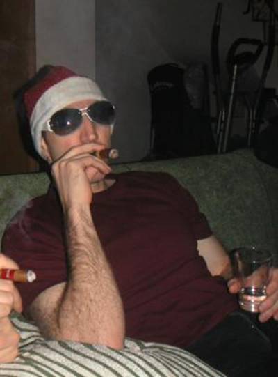 A dissolute Imagethief wallows in empty, carnal indulgence on Christmas eve with a fat smoke and Finnish vodka. Jackie O. shades hide eyes full of shame.